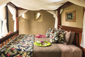 Relax in a four-poster bedroom with soft mattress in the best resorts in Fiji